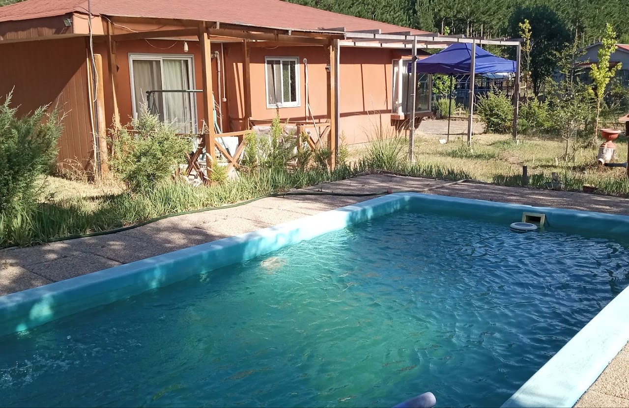 Parcela de agrado con casa y cabañas